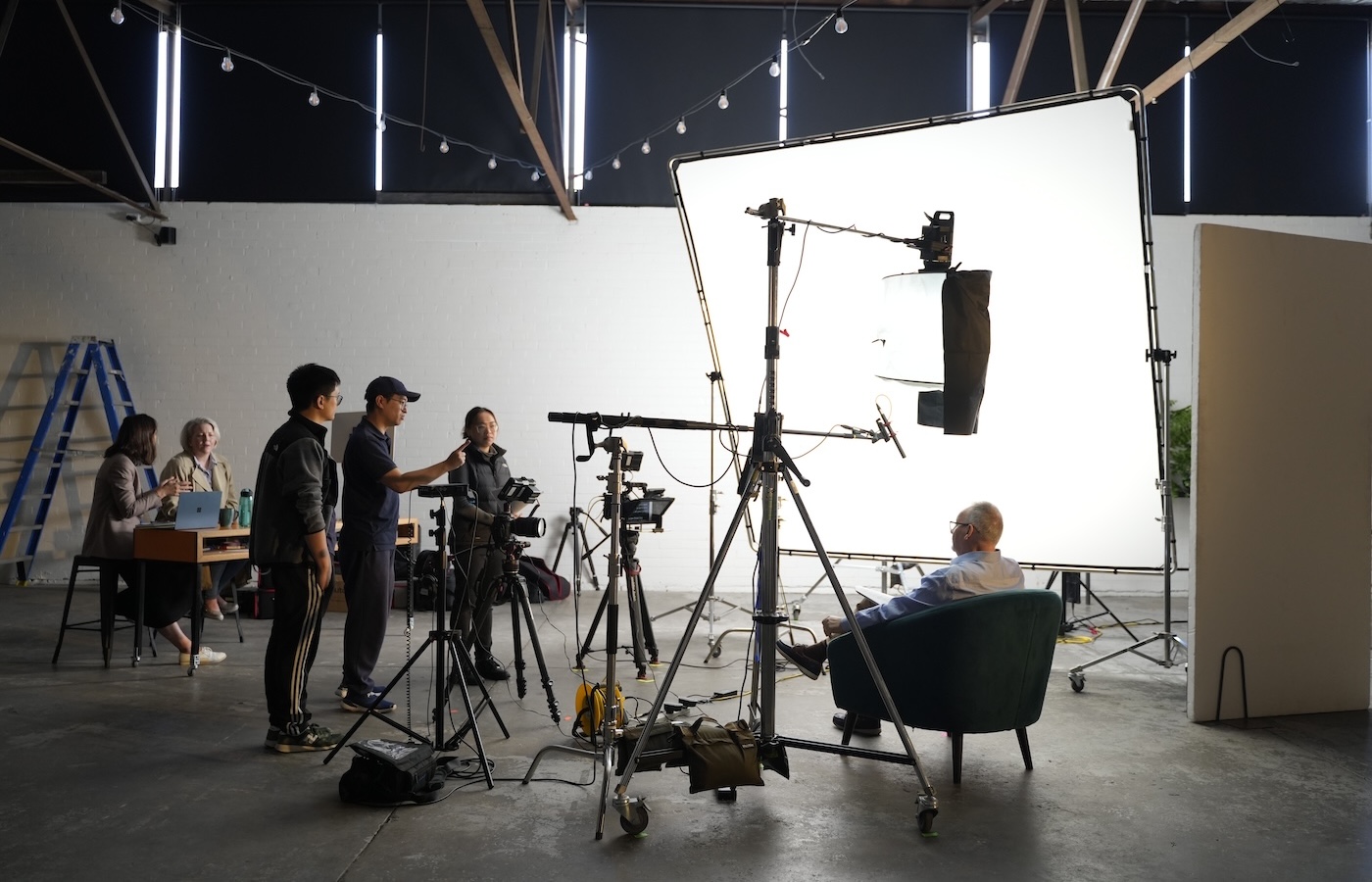 Camera and lighting setup during an on-location business interview